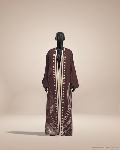 Long brown dress with white floral patterns on a mannequin against a beige background